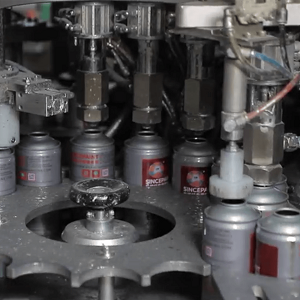 automatic aerosol can filling machine closeup.jpg